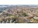 Expansive aerial view of a community showcasing homes nestled among trees at 20016 Walter Henderson Rd, Cornelius, NC 28031