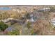 Scenic aerial view of a lakeside community with homes nestled among lush trees at 20016 Walter Henderson Rd, Cornelius, NC 28031