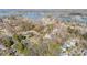 Expansive aerial view of a lakeside community showcasing homes nestled among trees with lake access at 20016 Walter Henderson Rd, Cornelius, NC 28031