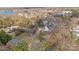 Aerial view showcasing the home's position with lakeside community amidst lush trees at 20016 Walter Henderson Rd, Cornelius, NC 28031