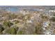 Scenic aerial view of a lakeside community with homes nestled among lush trees at 20016 Walter Henderson Rd, Cornelius, NC 28031