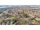 Expansive aerial view of a community showcasing homes nestled among trees at 20016 Walter Henderson Rd, Cornelius, NC 28031
