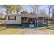 Charming single-story home featuring a cozy front porch and well-maintained landscaping at 20016 Walter Henderson Rd, Cornelius, NC 28031