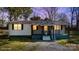 Charming single-story home featuring a cozy front porch and well-maintained landscaping at 20016 Walter Henderson Rd, Cornelius, NC 28031