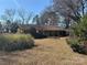 Inviting single-story home with a well-maintained front lawn and a cozy atmosphere at 201 Wingrave Dr, Charlotte, NC 28270