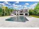 Gorgeous backyard featuring an in-ground pool, hot tub and tiled patio, perfect for outdoor entertaining at 211 Sugar Maple Ln, Weddington, NC 28104