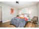 Comfortable bedroom featuring hardwood floors, neutral tones, and a closet at 2137 Highland St, Charlotte, NC 28208