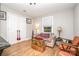 Cozy bedroom featuring hardwood floors, neutral paint, and a unique vintage style at 2137 Highland St, Charlotte, NC 28208
