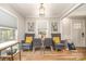 Bright, window-filled dining area with hardwood floors and comfortable seating at 2137 Highland St, Charlotte, NC 28208
