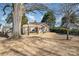 Beautiful blue home with a well-manicured lawn and light wood shutters at 2137 Highland St, Charlotte, NC 28208