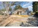 Charming home with a covered front porch, lovely blue exterior and nicely kept grounds at 2137 Highland St, Charlotte, NC 28208