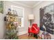 Compact office space featuring a unique bar cart, and an interesting piece of wall art at 2137 Highland St, Charlotte, NC 28208