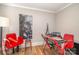 Small office featuring red chairs, a desk, and a modern lamp at 2137 Highland St, Charlotte, NC 28208
