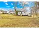 Backyard with an unfenced yard and a small house in the background at 216 Blackwelder St, Kannapolis, NC 28081