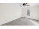 Neutral bedroom with plush carpet, a ceiling fan, and a bright window at 216 Blackwelder St, Kannapolis, NC 28081