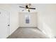 Neutral bedroom with plush carpet, a ceiling fan, and a bright window at 216 Blackwelder St, Kannapolis, NC 28081