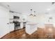 Modern kitchen boasts granite countertops, stainless steel appliances, and ample cabinet space at 216 Blackwelder St, Kannapolis, NC 28081