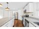 Updated kitchen features granite countertops, stainless steel appliances, and modern finishes at 216 Blackwelder St, Kannapolis, NC 28081