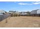 Large backyard space, surrounded by a wooden fence, perfect for outdoor activities at 2462 Willow Pond Se Ln, Concord, NC 28025
