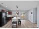 Bright and modern kitchen, granite counters, an island with seating, and sliding doors to outdoor area at 2462 Willow Pond Se Ln, Concord, NC 28025