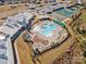 Aerial view showcasing a community pool, clubhouse, and recreation area in a residential neighborhood at 4018 Moxie Way, Charlotte, NC 28215