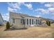 Large backyard with patio and sunroom, perfect for outdoor entertaining and relaxation at 4018 Moxie Way, Charlotte, NC 28215