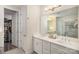 Bright bathroom featuring double sinks, walk-in shower, and ample storage at 4018 Moxie Way, Charlotte, NC 28215