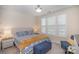 Well-lit bedroom with coordinated decor and a comfortable seating area at 4018 Moxie Way, Charlotte, NC 28215