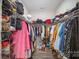 Walk-in closet with ample storage space for clothes and shoes at 4018 Moxie Way, Charlotte, NC 28215