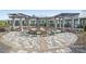 Community fire pit area with comfortable seating and elegant pergola, perfect for gatherings at 4018 Moxie Way, Charlotte, NC 28215