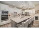 Modern kitchen featuring stainless steel appliances, white cabinets, and a large central island with seating at 4018 Moxie Way, Charlotte, NC 28215