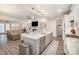 Bright, open kitchen with an island, stainless steel appliances, and seamless flow to the living area at 4018 Moxie Way, Charlotte, NC 28215
