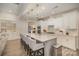 Gourmet kitchen featuring a large island with bar seating, white cabinets, and modern fixtures at 4018 Moxie Way, Charlotte, NC 28215