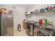Laundry room with stainless steel appliances, sink, and storage at 4018 Moxie Way, Charlotte, NC 28215