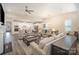 Inviting living room with a cozy seating arrangement and views into the modern kitchen at 4018 Moxie Way, Charlotte, NC 28215