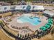 Aerial view showcasing a community pool area with lounge chairs and well-maintained landscaping at 4018 Moxie Way, Charlotte, NC 28215