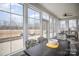 Bright sunroom with large windows, outdoor views and a ceiling fan at 4018 Moxie Way, Charlotte, NC 28215