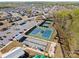 Aerial view featuring community tennis courts, parking, and amenities in a residential neighborhood at 4018 Moxie Way, Charlotte, NC 28215