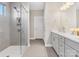 Stylish bathroom with a glass-enclosed shower, neutral tile, and double sink vanity at 4039 Highgate Ln, Lancaster, SC 29720