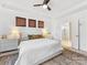 Spacious primary bedroom with tray ceiling, neutral tones, and a view of the ensuite bathroom at 4039 Highgate Ln, Lancaster, SC 29720