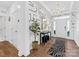 Charming foyer features artistic wallpaper, a wood floor, modern decor, and an entry to a powder room at 4039 Highgate Ln, Lancaster, SC 29720