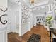 View of the foyer showing the wood floors, artistic wall paper, adjacent bath and formal rooms at 4039 Highgate Ln, Lancaster, SC 29720