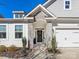 Inviting front entrance with stone accents, manicured bushes, and a black front door at 4039 Highgate Ln, Lancaster, SC 29720