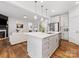 Gourmet kitchen with stainless steel appliances and quartz countertops; living room view at 4039 Highgate Ln, Lancaster, SC 29720