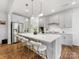 Modern kitchen with stainless steel appliances, white cabinets, and quartz countertops at 4039 Highgate Ln, Lancaster, SC 29720