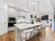 Spacious kitchen island featuring a sink, barstool seating, and pendant lighting at 4039 Highgate Ln, Lancaster, SC 29720