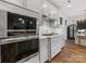 Kitchen featuring stainless appliances, oven, microwave, and white herringbone backsplash at 4039 Highgate Ln, Lancaster, SC 29720