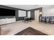 Spacious living room featuring a TV, white cabinets, modern furniture, and dark accent walls at 4039 Highgate Ln, Lancaster, SC 29720