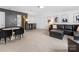 Spacious living room with plush seating, a modern table, and carpet floors perfect for relaxing or entertaining at 4039 Highgate Ln, Lancaster, SC 29720