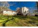 Spacious backyard featuring a wooden deck, a detached garage, and lush green grass at 4919 Rehobeth Rd, Waxhaw, NC 28173